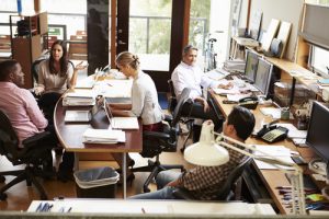 Interior Of Busy Architect's Office With Staff Working