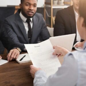 Job candidate presenting resume to interview panel